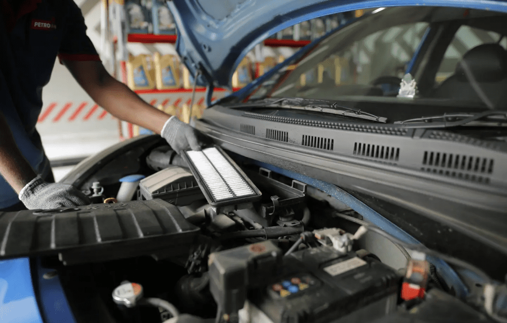 A mechanic working on a car.