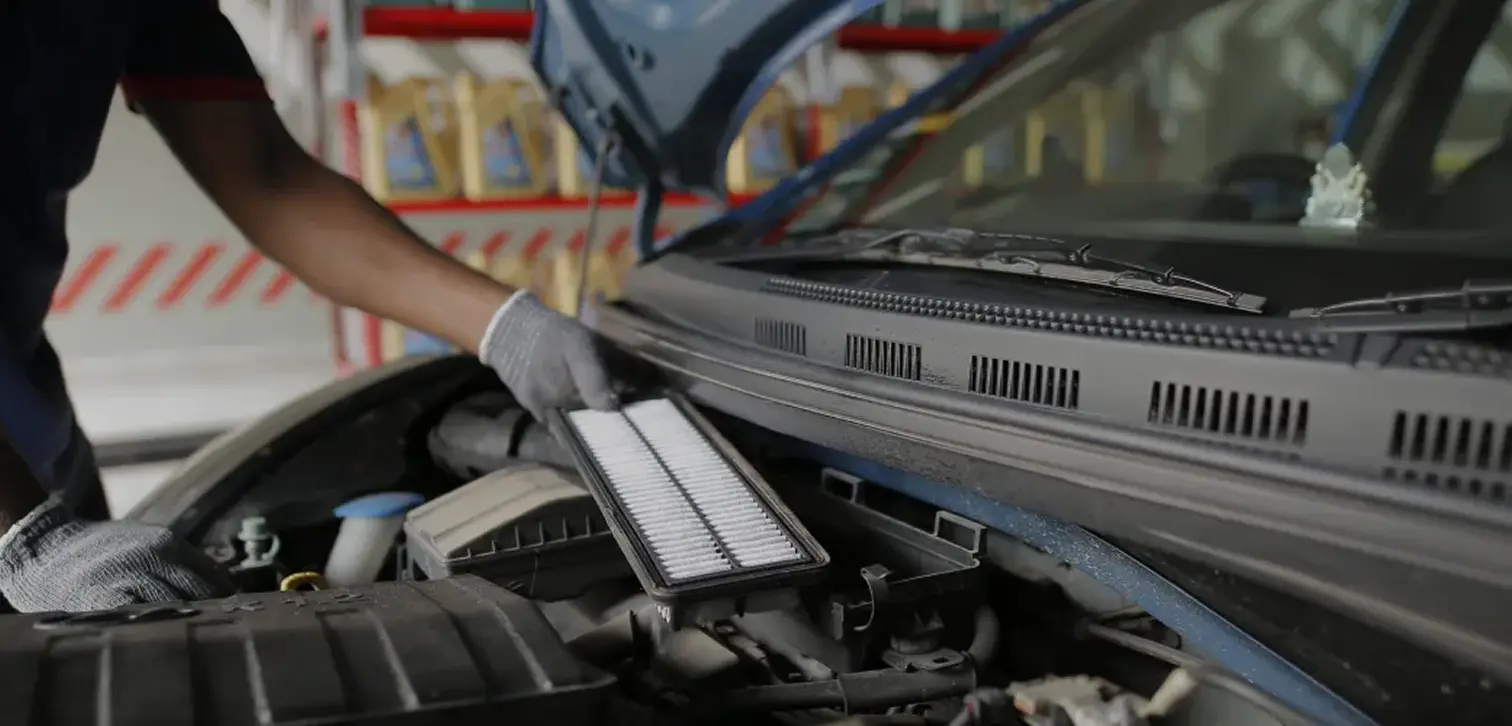 A mechanic working on a car.
